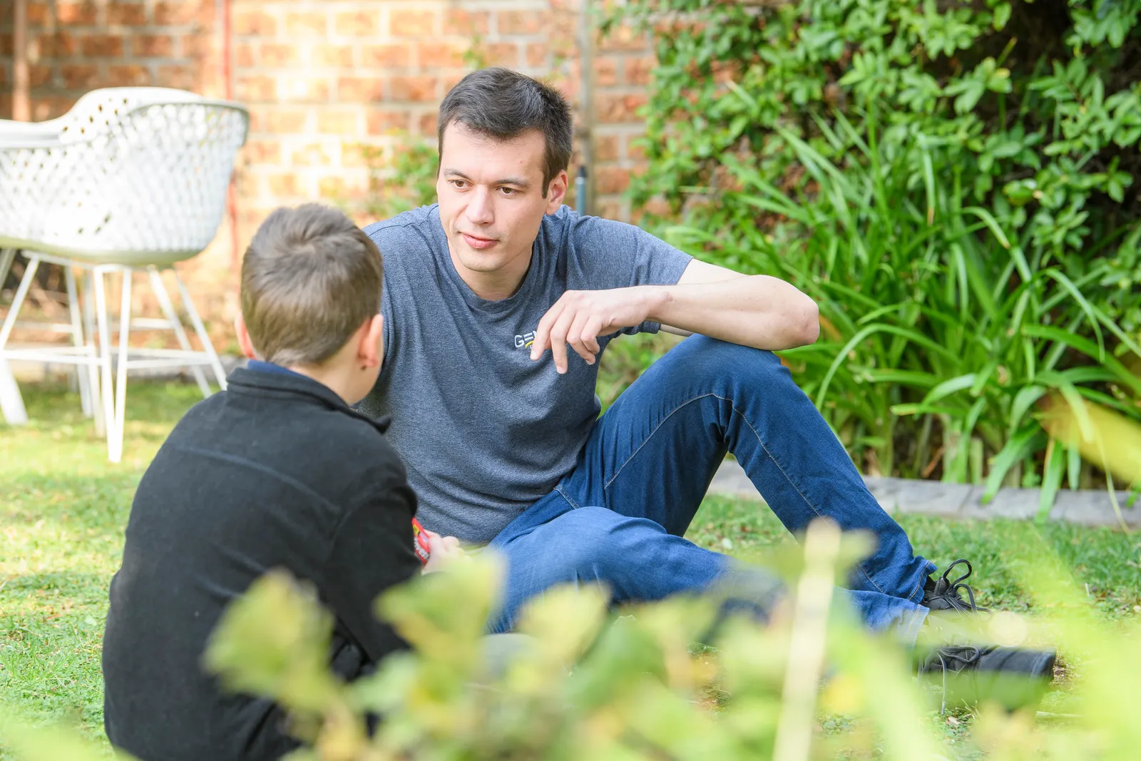 A Genius Education Leader listening attentively during a student consultation
