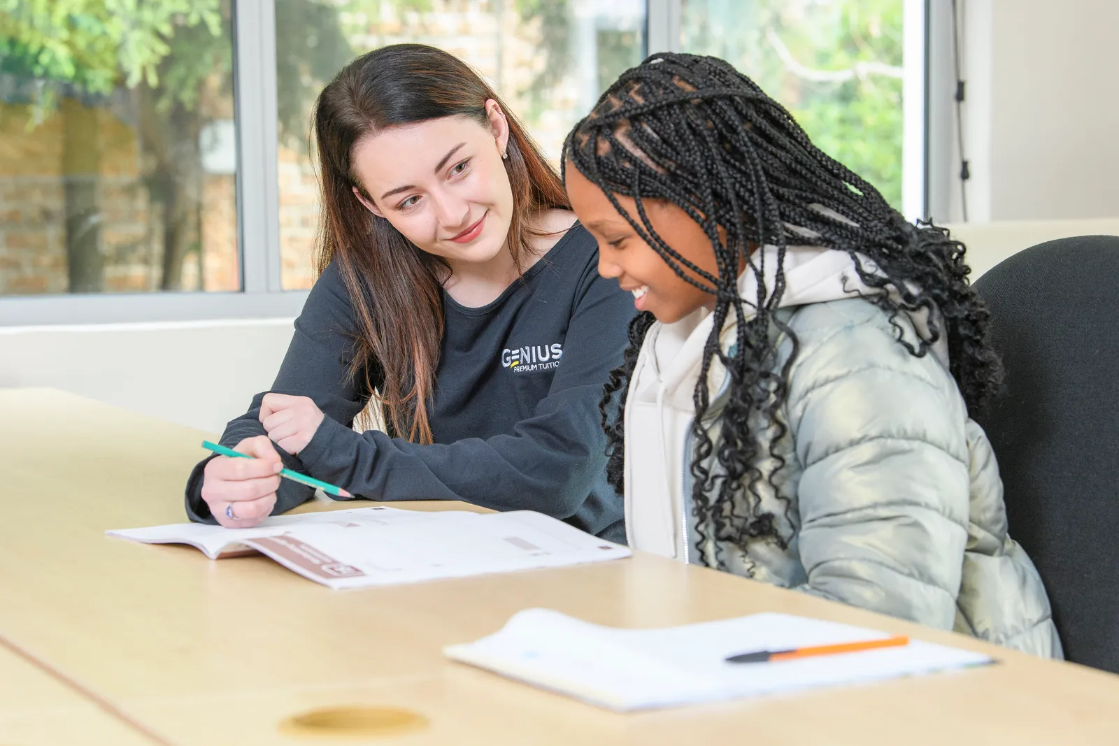 A Genius tutor and student enjoying a one-to-one lesson together